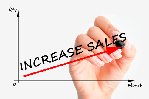 drawing of a hand drawing an up arrow with increase sales written on it