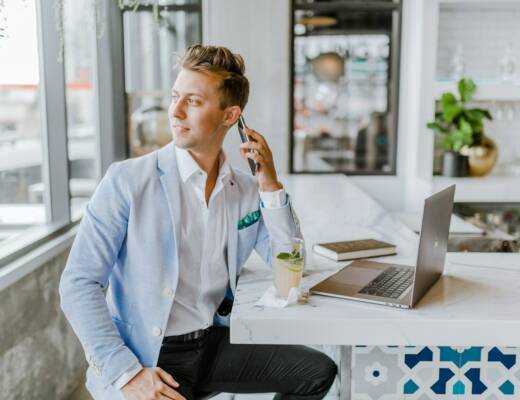man sitting beside white wooden table; Due Diligence