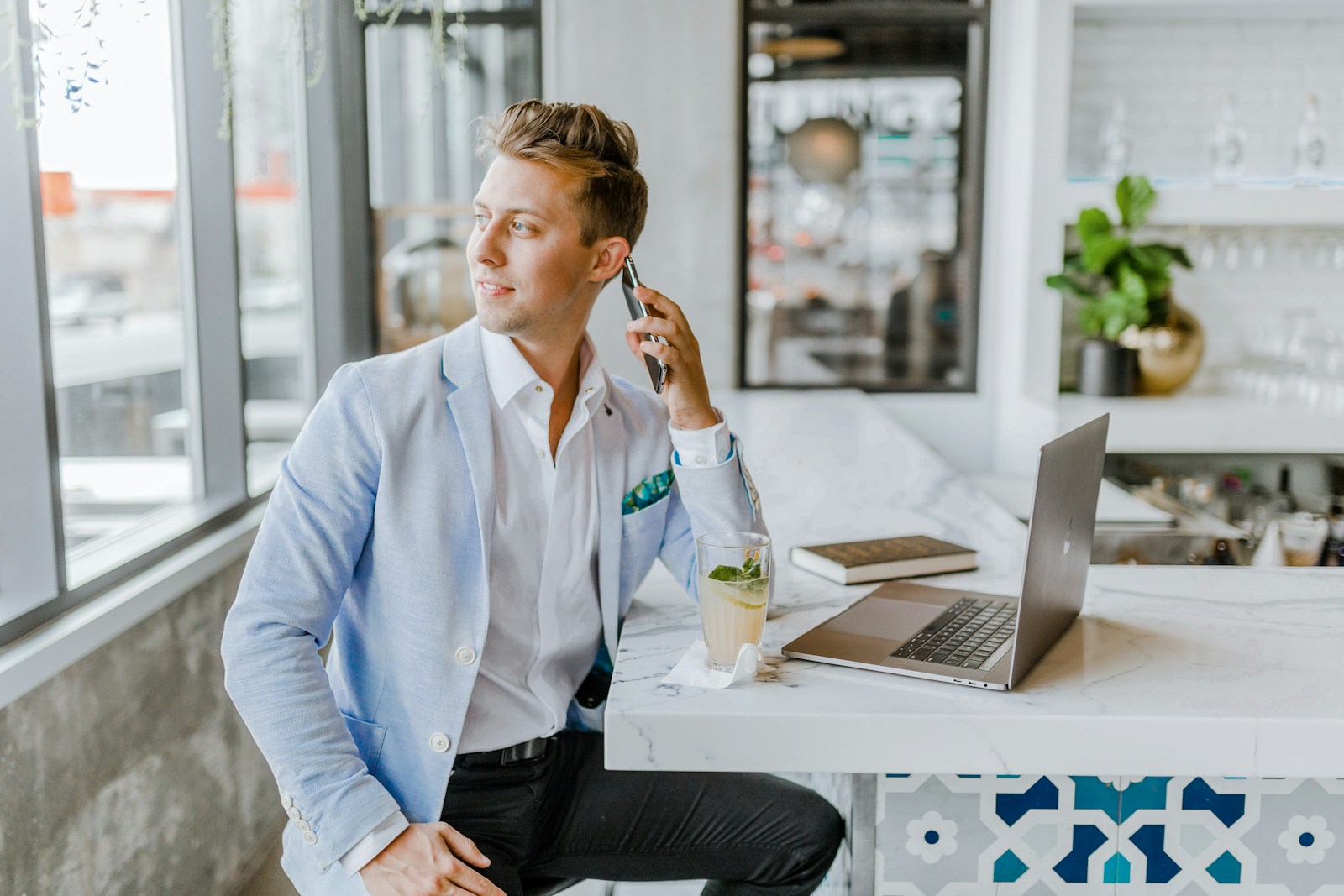 man sitting beside white wooden table; Due Diligence
