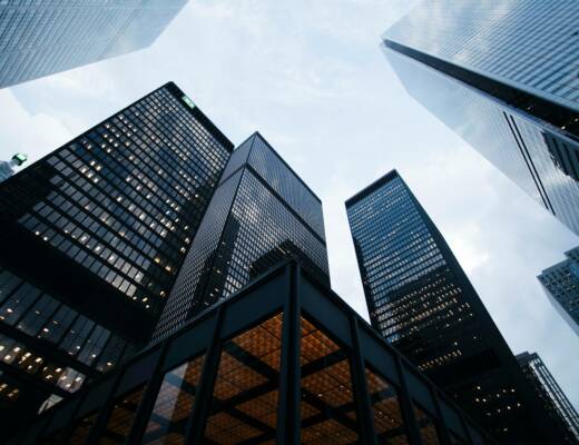 low angle photo of city high rise buildings during daytime; Gross Margin