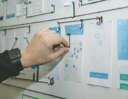 person working on blue and white roadmap.