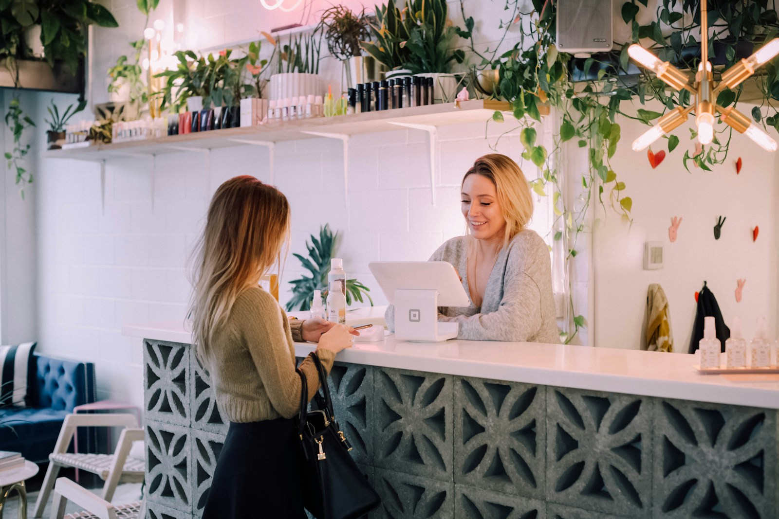 woman facing on white counter; reduce churn rate