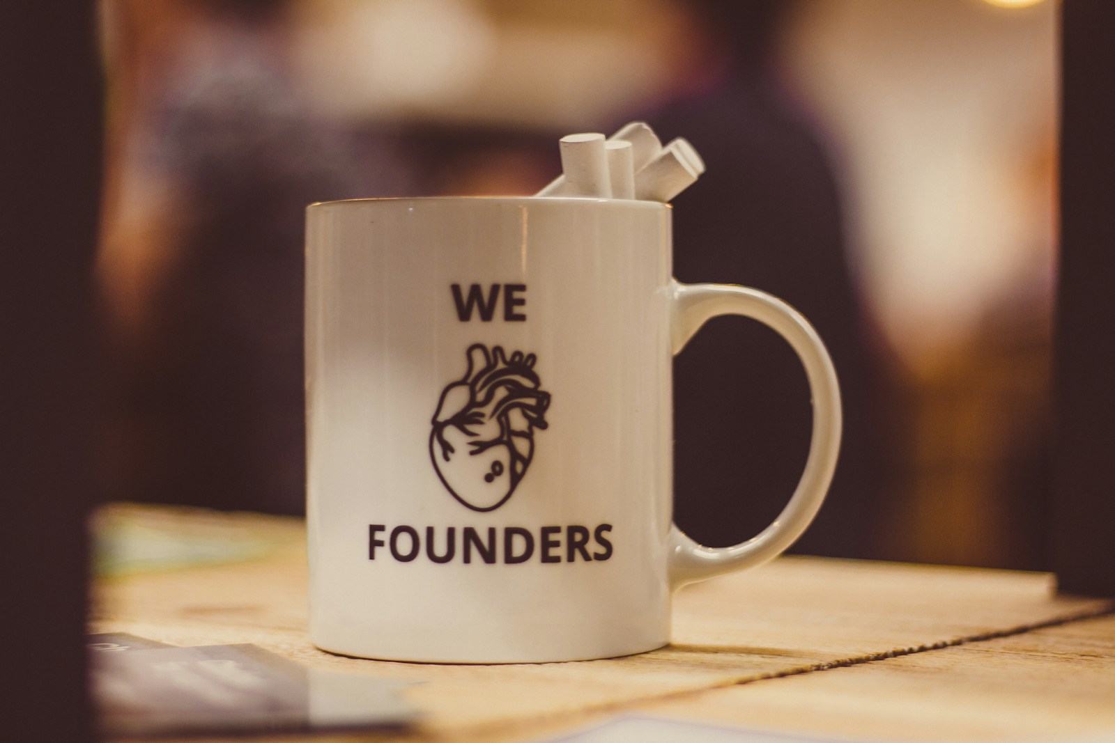 selective focus photo of we Founders heart-printed ceramic mug; Unspoken Rule