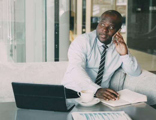 Thoughtful startup founder reflecting on profitability and business success