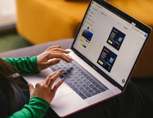 a woman sitting on a couch using a laptop computer; validate marketing channels
