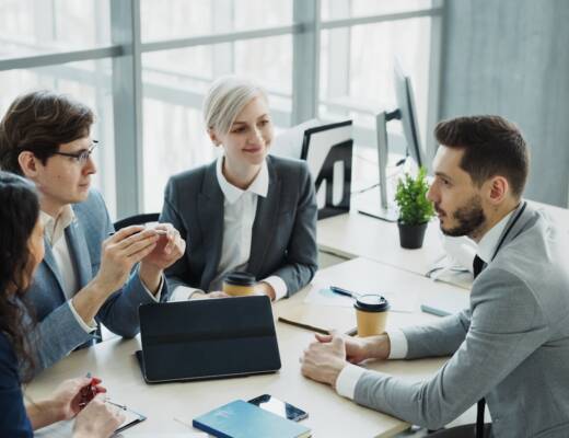 Diverse business team collaborating in a modern office; make tough decisions