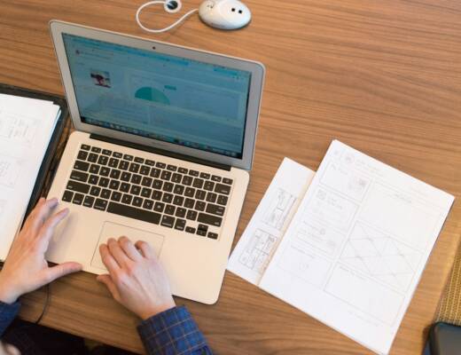 person using MacBook Air; small business software