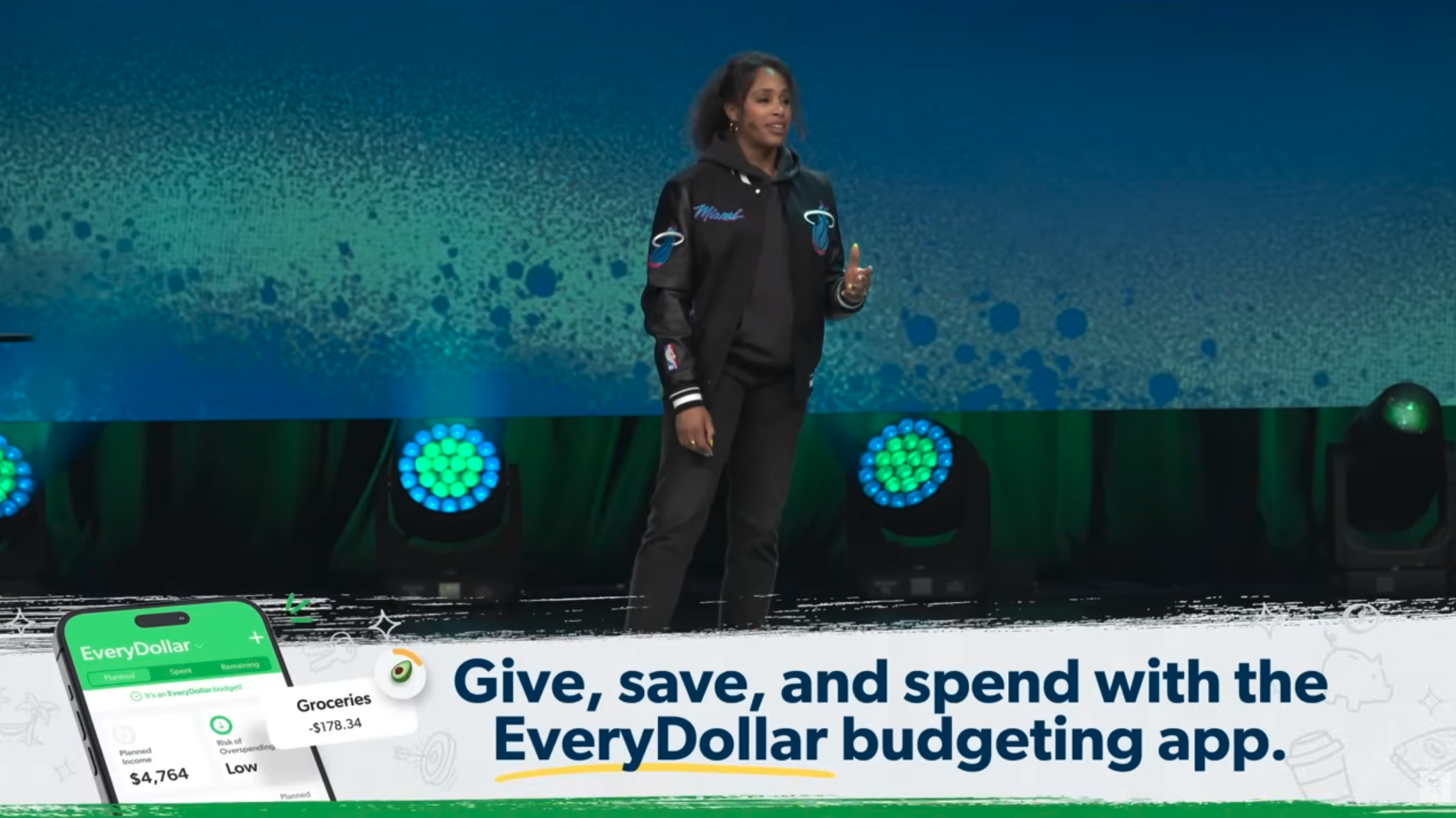 Image of The Ramsey Show Highlights Youtube channel host speaking to large audience about financial planning; financial freedom purpose