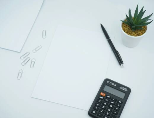 black calculator beside black pen on white printer paper; financial discipline startups alive