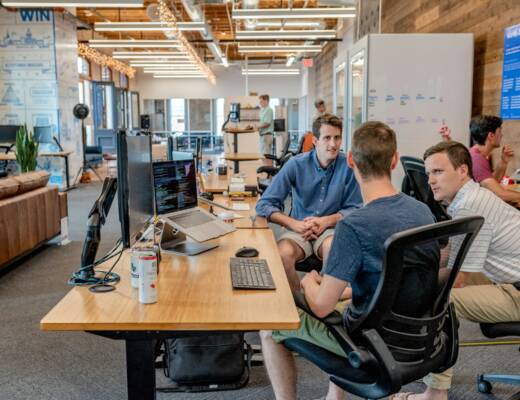 founder and two team members meeting in conference room; communication mistakes inexperienced founders