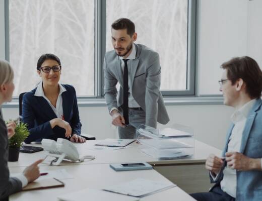 Business professionals collaborating around a conference table; founders net revenue retention