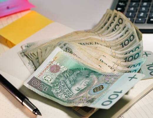 Cash laying on desk as though it's being counted; financial boundaries family guilt