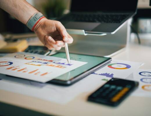 a person is writing on a piece of paper; simplify startup financial system