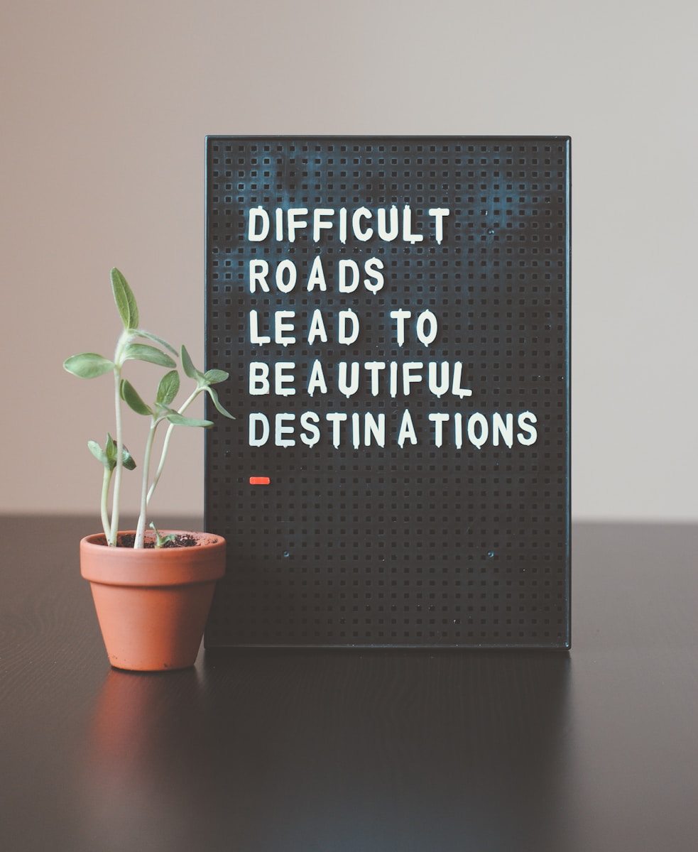 difficult roads lead to beautiful destinations desk decor; uncertain without losing momentum
