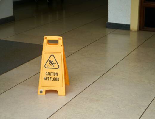 yellow caution wet floor sign; business customer safety