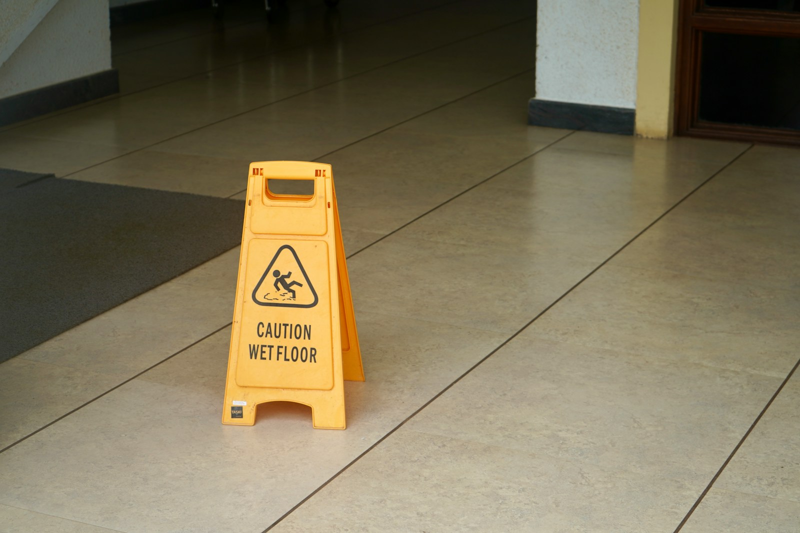 yellow caution wet floor sign; business customer safety