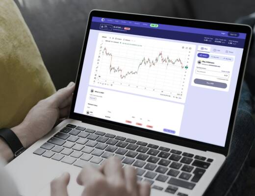 a person using laptop and reviewing the market updates; blaming policy fixing cash