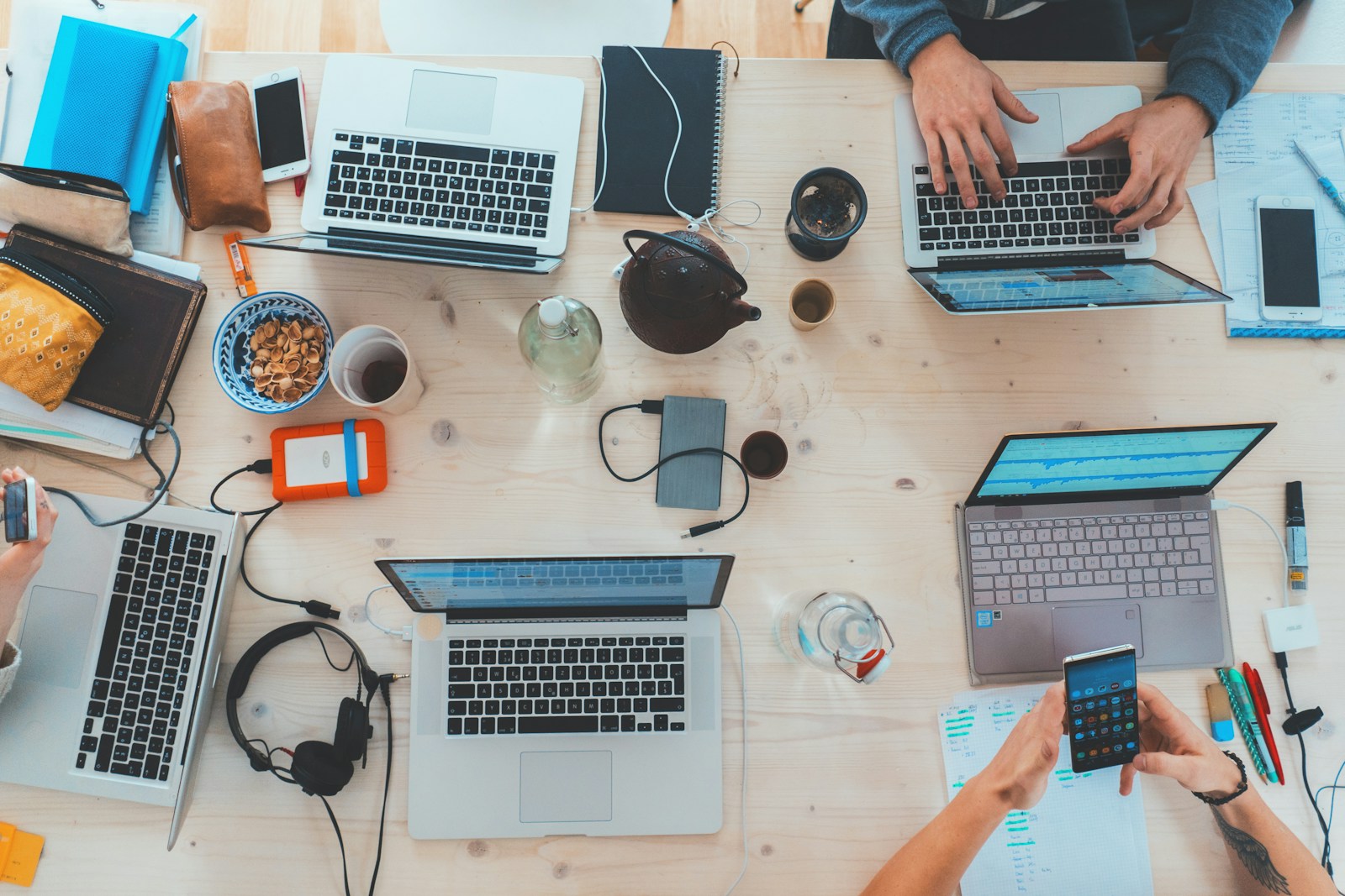 people sitting down near table with assorted laptop computers; ai reshape job